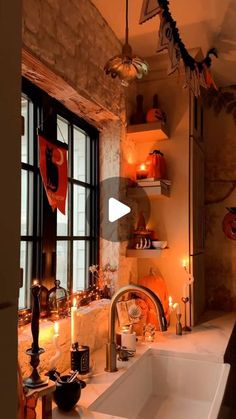 a bathroom decorated for halloween with candles and decorations