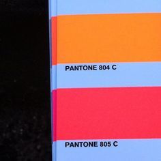 an orange, yellow and blue book with the words pantonee 804 c on it