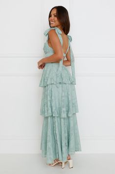 Length from bust to hem of size S: 114cm. Chest: 37cm, Waist: 32cm, across front only of size S. Maxi dress. Lined. Model is a standard XS and is wearing size XS. True to size. Non-stretch. Textured fabrication. Tiered frill hem. Open back. Elastic back with silver closure. Tie-up shoulder straps. Zipper. Print placement may vary. Cold hand wash only. Polyester/Spandex. Enter the room in an extravagant style. The Alix Maxi Dress features a tiered frill skirt, an open back, and tie-up shoulder st