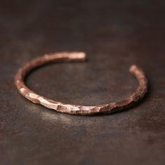 Rustic Steampunk Retro Handcuff Bangle Hammered Copper Bracelet - Viking Handmade Bracelet Vintage Description: Discover the allure of our Hammered Copper Bracelet, a rustic and steampunk-inspired cuff that exudes vintage charm. This handcrafted piece features a round shape with a textured surface, making it a minimalist yet special accessory. The timeless design ensures its relevance for any occasion. Made from pure copper, this bracelet is not only a stylish addition to your wardrobe but also Handmade Copper Bracelet, Hammered Cuff Bracelet, Health Bracelet, Copper Jewellery, Copper Cuff, Copper Bracelet, Hammered Copper, Unisex Gifts, Unisex Jewelry