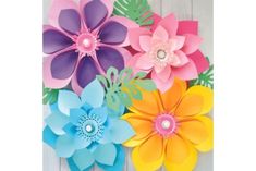 paper flowers are arranged in different colors