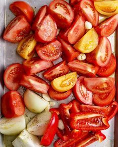 sliced tomatoes and onions on a tray ready to be cut into wedges or cubes