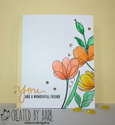 a card with flowers on it and some candy in front of the card that says you are a wonderful friend