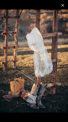 an old boot is sitting on the ground next to a plastic bag