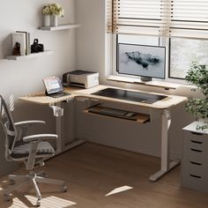 a computer desk with a monitor and keyboard on it in front of a windowsill