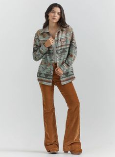 NO NEED TO STEAL FROM HIS CLOSET No cowboy's going to be able to pull this off quite as well as you. The women's Wrangler Retro® long-sleeve boyfriend fit snap shirt takes a fresh approach to the classic western style you know and love. It features an easy, slightly oversized fit and southwestern print to deliver the perfect amount of femininity. This western snap shirt also comes with pointed yokes from front to back, two chest flap pockets with snaps, a spread collar, and a full snap closure. Plus Jumpsuit, Southwestern Print, Retro Women, Top Graphic Tees, Sweater Set, Boyfriend Fit, Mens Outerwear, Western Shirts, Trouser Jeans