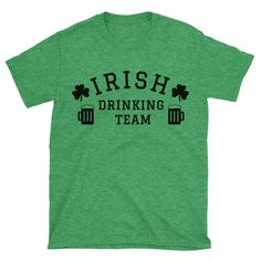 "Welcome to FamFam Shirts. This listing is for one \"Irish Drinking Team\" graphic t shirt. Style: Unisex Sizes available: S, M, L, XL, 2XL,3XL Size and color chart is available in the last image. Each item is made to order. Processing time 1-3 business days. Please let us know if you need you order by the certain date. All orders are Shipped with USPS. Please message us on Etsy if you have any questions. Thanks for visiting FamFam Shirts shop" Irish Shirts Women, St. Patrick's Day Graphic T-shirt, St. Patrick's Day Graphic Tee With Graphic Print, St. Patrick's Day Graphic Tee, St. Patrick's Day Crew Neck T-shirt, Green Pre-shrunk T-shirt For St. Patrick's Day, St. Patrick's Day Graphic Tee With Print, Drinking Team, Cheap St. Patrick's Day Crew Neck T-shirt