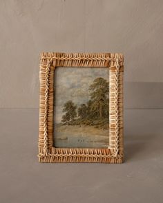 a wicker frame with a painting on it