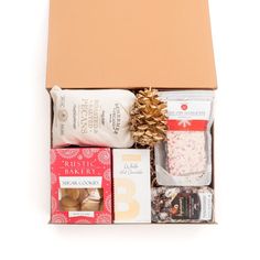 a box filled with lots of different types of food and confection on top of each other