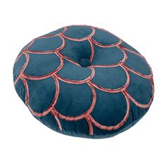 a blue and red round pillow with an intricate design