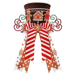 a top hat decorated with gingerbreads and candy canes is shown on a white background