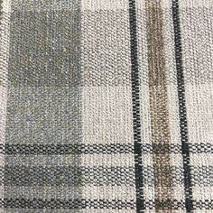 a close up view of a checkered rug with black and white stripes on it