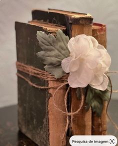 an old book with a flower on it