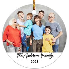 a family photo ornament hanging on a wall with the words, the anderson family 2013