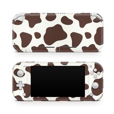 an animal print nintendo wii game console skin for the new 3ds, featuring a brown and white cow pattern