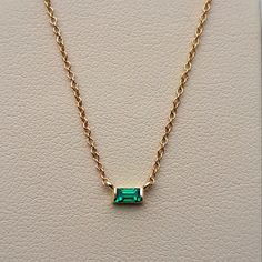 An Absolutely Chic Natural Emerald Solitaire Pendant. It's A Medium-Green, The Perfect Emerald Shade! No Inclusions And Sparkly! This Is A Lively Emerald, Which Is Pretty Difficult To Find In The Baguette Cut. Channel Set Into 14 Karat Yellow Gold. This Necklace Is Adjustable By 3 Sizes! Ranging Between 16 Inches And 18 Inches, Making It Perfect To Wear By Itself Or For Layering Necklaces. (Which Is Very In Style Right Now!) Packaged With A Luxury Gift Box And Complimentary Travel Pouch And Poli Fine Jewelry 14k Gold Baguette Cut Necklace, 14k Gold Baguette-cut Fine Jewelry Necklace, 14k Gold Baguette Cut Fine Jewelry Necklace, Formal Baguette Gemstone Jewelry, Fine Jewelry In 14k Gold With Baguette Shape, Fine Jewelry 14k Gold Baguette, Fine Jewelry Baguette 14k Gold, Yellow Gold Baguette Gemstone Jewelry, 14k Gold Baguette Fine Jewelry