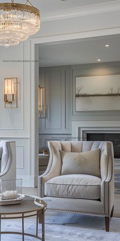 a living room filled with furniture and a chandelier