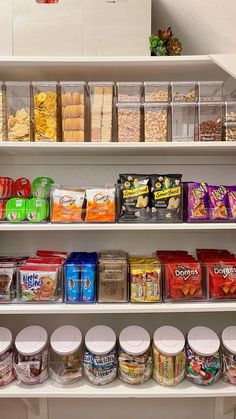 the shelves are filled with many different types of snacks and food items to choose from