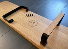 a close up of a wooden table with scissors and screwdrivers on the top