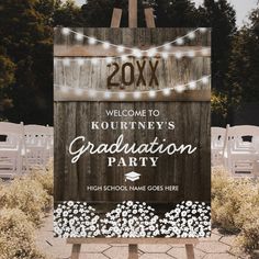 a wooden sign that says welcome to kourtney's graduation party with lights on it