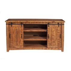 a wooden entertainment center with sliding doors on the front and bottom shelves, in an oak finish