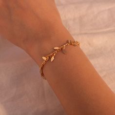 ❤️ Grab 3 fabulous items and enjoy a delightful 25% off when you use the code BUY3GET25 This bracelet features a gold leaf shape tassel, adding a touch of sophistication to her wrist. It's the best gift choice for her, reflecting both your thoughtfulness and her individuality. Embrace the beauty of geometric shapes and the elegance of gold with our bracelets, a perfect accessory to showcase her unique style and make her feel special. #YOU MAY LIKE THIS Personalized Mother of Pearl Bracelet https Elegant Gold Dangle Charm Bracelet, Trendy Dangle Charm Bracelet, Gold Plated Chain Bracelet For Her, Gold Bohemian Dangle Bracelets, Minimalist Charm Bracelet For Parties, Party Charm Bracelet With Dangle, Chic Gold Charm Bracelet As Gift, Trendy Gold Charm Bracelet With Delicate Chain, Chic Gold Charm Bracelet Gift