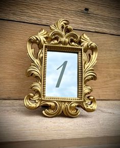 a gold frame with a number one in it