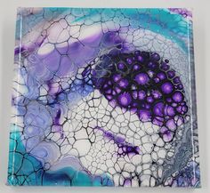 a glass plate with purple and blue designs on it