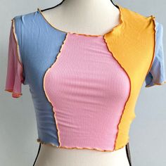 Pink/Yellow/Blue Crop Top With The Back All Blue *Unused* Size: Xs Multicolor Tops With Color Matching For Spring, Multicolor Tops With Color Matching For Summer, Pink Short Sleeve Top With Contrast Color, Pink Short Sleeve Tops With Contrast Color, Pink Contrast Color Short Sleeve Top, Multicolor Contrast Color Tops For Summer, Pink Fitted Patchwork Top, Trendy Yellow Patchwork Top, Fitted Pink Patchwork Top