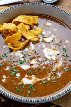 a bowl filled with soup and tortilla chips