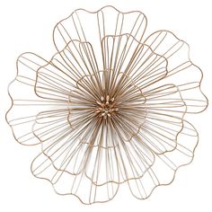 a gold metal flower decoration on a white background