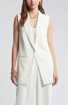 Create chic layered looks with this long, stretch-woven vest sewn with shapely seams for a tailored, office-ready appearance. 32" length (size Medium) One-button closure Notched lapels Chest besom pocket; front welt pockets 96% polyester, 4% spandex Machine wash, tumble dry Imported