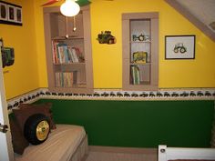 a bedroom with yellow walls and green trim on the wall, two bookshelves