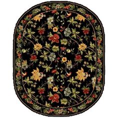 an oval rug with flowers and leaves on the center is shown in red, green, yellow