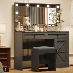 a dressing table with stool and mirror in a room