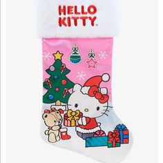 a hello kitty christmas stocking hanging on a wall