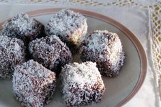 a plate full of chocolate crumbs sitting on a tablecloth covered table cloth