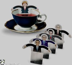 a tea cup and saucer with the image of people in it, on top of each other