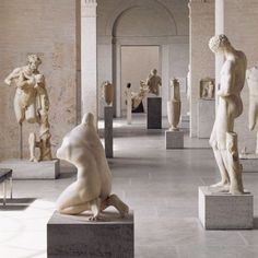 many statues are in the middle of a room