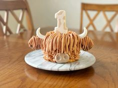 a cake shaped like a bull with horns on it