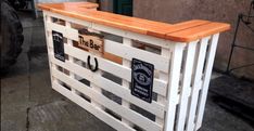 an outdoor bar made out of pallet wood