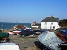 there are many boats that are parked in the lot