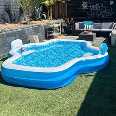 an inflatable swimming pool on the lawn