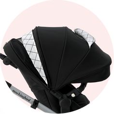 a black and white baby stroller with its seat folded up in front of it