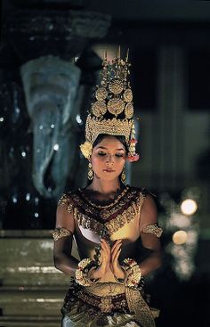 a woman dressed in traditional thai garb