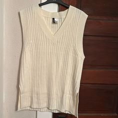 Nwot H&M Divided Cream Colored Sweater Vest. This 100 Percent Acrylic Sleeveless Sweater Is A Size Small. It’s About 20 Inches P2p With Some Stretch. Gorgeous Fall Staple! White V-neck Tank Top For Winter, Cotton Tank Sweater Vest For Fall, Sleeveless Cotton Sweater Vest, Cotton Sleeveless Sweater Vest For Fall, Cotton Sleeveless Sweater Vest, White Sweater Vest For Fall, White Sleeveless Sweater Vest For Fall, Cotton Tank Vest For Fall, White Cotton Tank Top For Fall