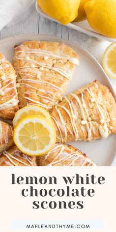 lemon white chocolate scones with icing on a plate next to sliced lemons