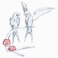 two crystal birds on a branch with flowers in the foreground and one bird perched on it's back