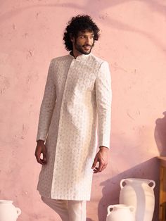 SHRESTHA By VASTRAMAY Men's Cream Georgette Embellished Indo Only Top Designer Fitted Sherwani For Spring, Fitted Sherwani For Festive Spring Occasions, Spring Festive Fitted Sherwani, Elegant Spring Wedding Sherwani, Spring Formal Fitted Sherwani, Fitted White Sherwani For Spring, Elegant White Sherwani For Spring, White Fitted Sherwani For Spring, Elegant Spring Sherwani With Floral Embroidery