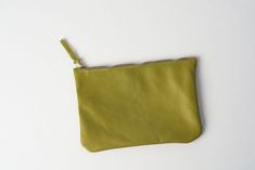 This green leather pouch is handmade from smooth genuine leather. It is perfect to hold your pencils and little items such as coins, telephone charger, lipsticks and little treasures It comes with a durable zipper and without lining. It is possible to order the small leather zipper bag in another color or size, just drop me a message for advice! Money Case, Zipper Purse, Pencil Bag, Toiletry Kit, Vanity Case, Pencil Bags, Cosmetic Pouch, Small Wallet, Leather Zipper